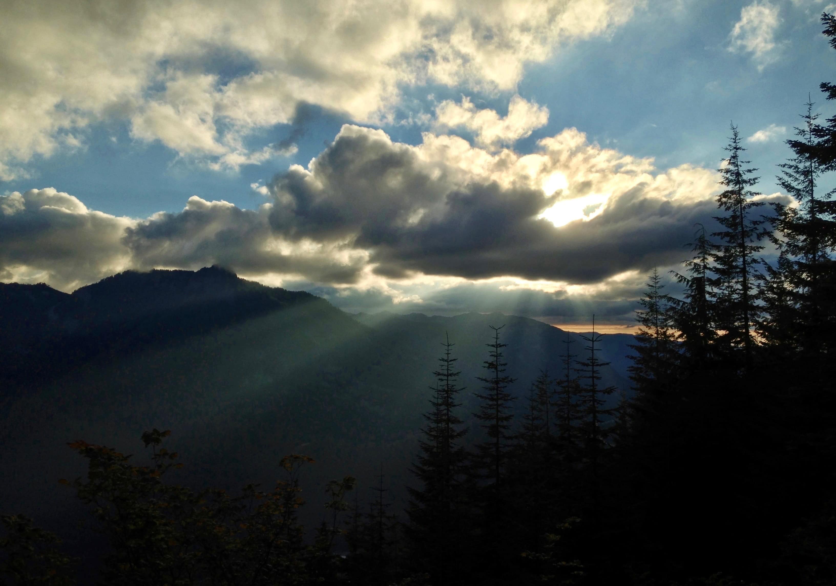Day's last splendor bursts over McClellan Butte and Mount Washington. Ira Spring Trail, August 18, 2013.